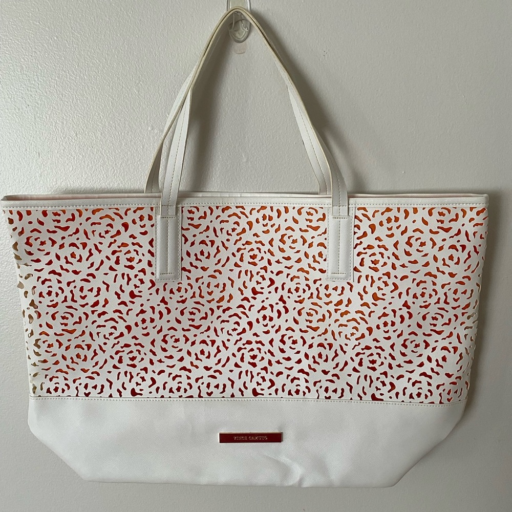 Vince Camuto white vegan leather tote with laser cuts. 14.5”L x 7.5”W x13.5”H